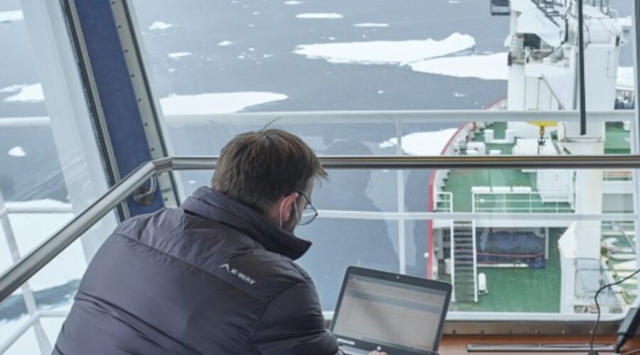 A man on a ship in the arctic